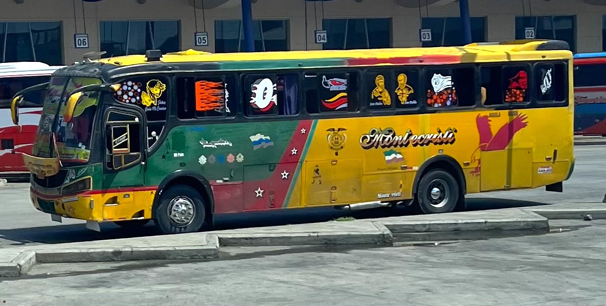 Vibrantly decorated bus with colorful stickers.