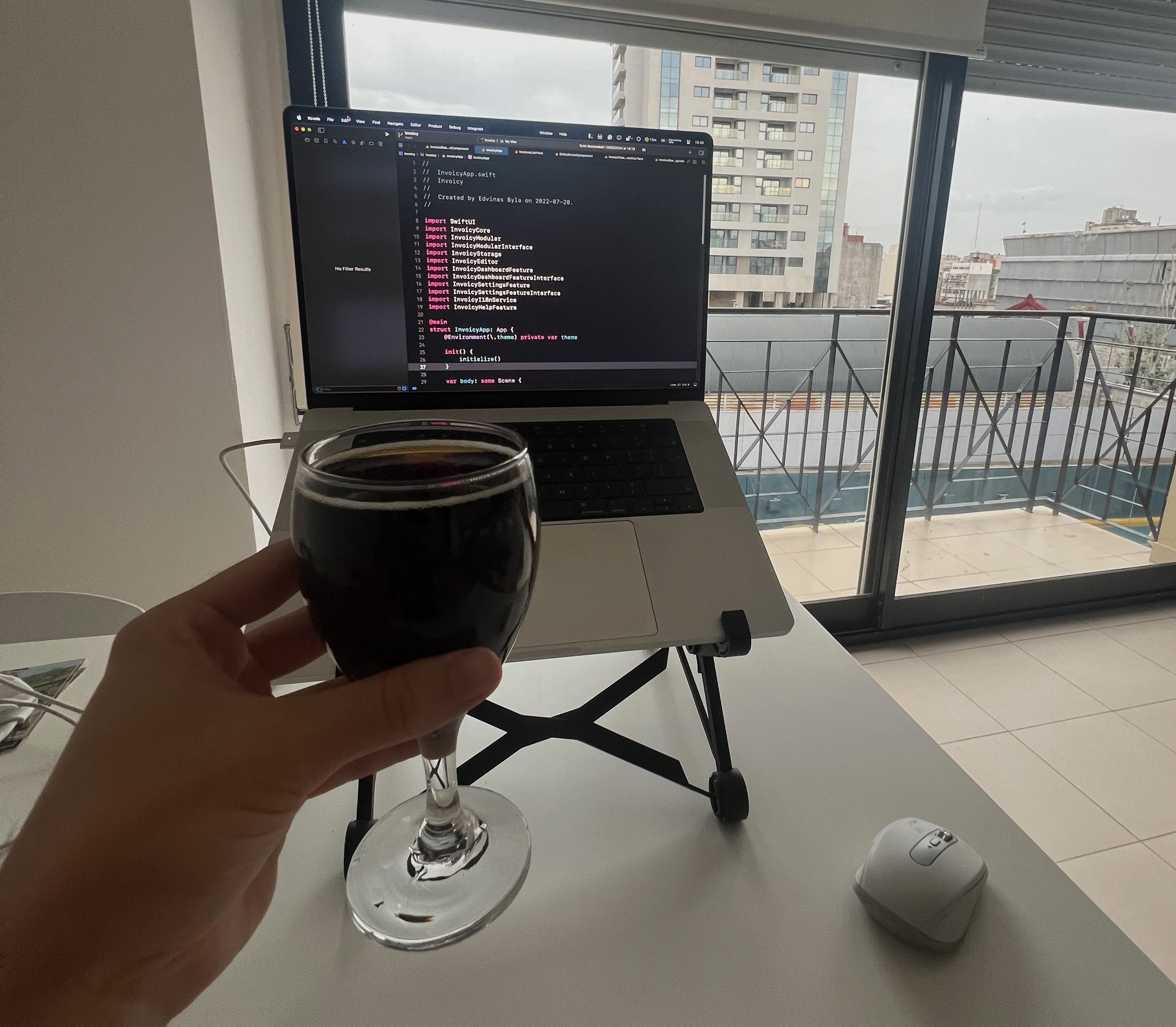 Me toasting a glass of coke zero to the laptop with views of Buenos Aires.